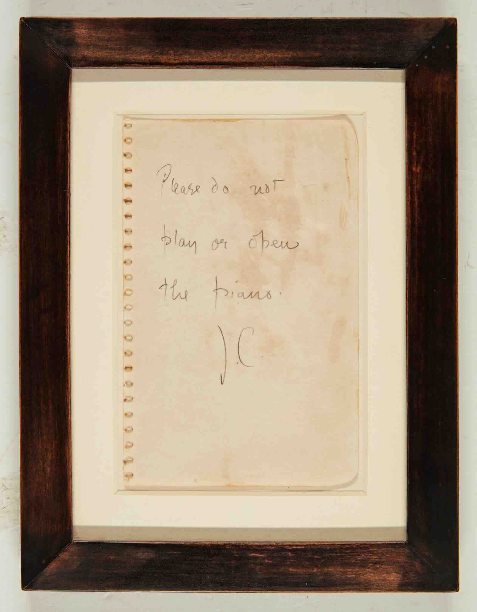 John Cage's signed note “Please do not play or open the piano. J.C.”